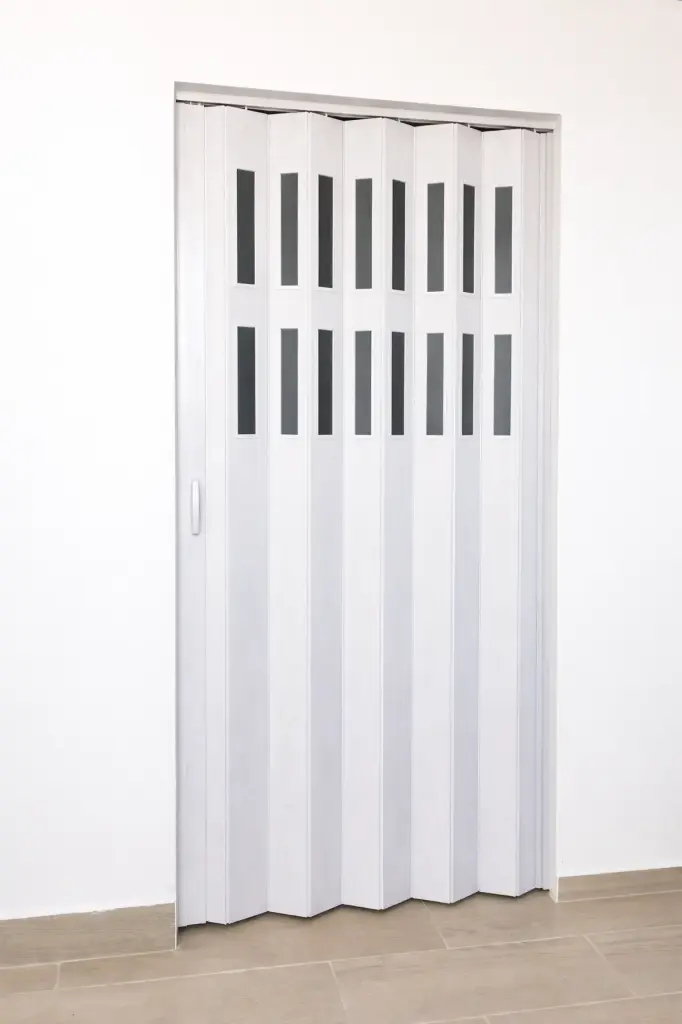 Puerta plegable corrediza - Plástica (PVC) - Con ventanillas de cristal acrílico - Fabricación a medida