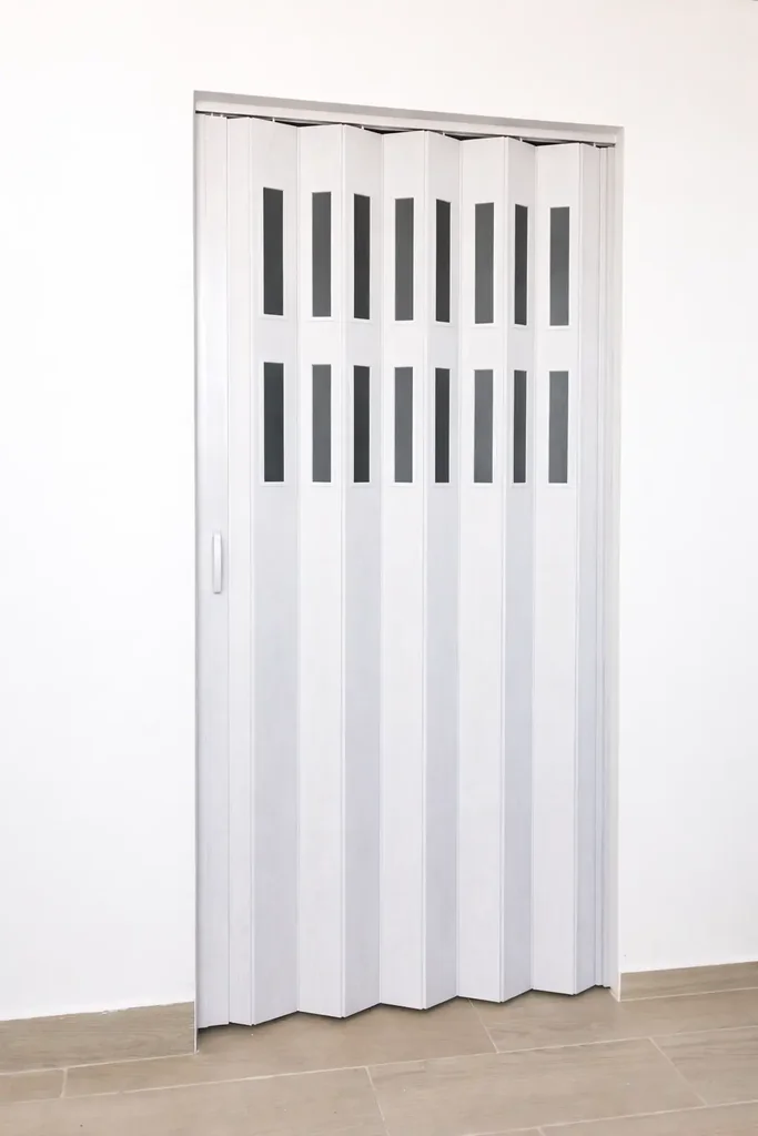 Puerta plegable corrediza - Plástica (PVC) - Con ventanillas de cristal acrílico - Fabricación a medida