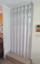 Puerta plegable corrediza - Plástica (PVC) - Con ventanillas de cristal acrílico - Fabricación a medida